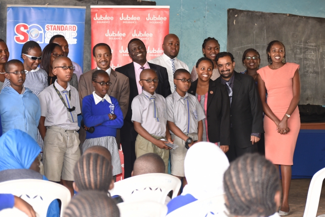  Jubilee Insurance, Standard Group, Kenya Society for the Blind and Kilimani Primary members pose together for a group photo. 
