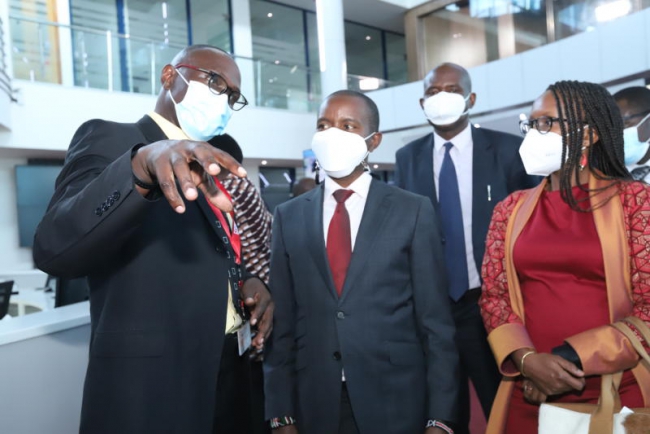  Standard Media Editorial Director Ochieng' Rapuro takes guests ICT Cabinet Secretary Joe Mucheru and other board members for a tour in the newsroom