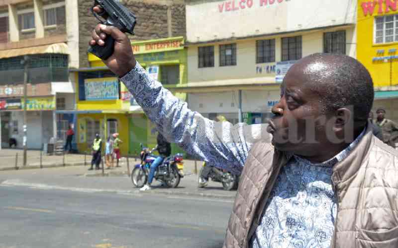 Photos: MP Arama draws gun, threatens to shoot looters during protests