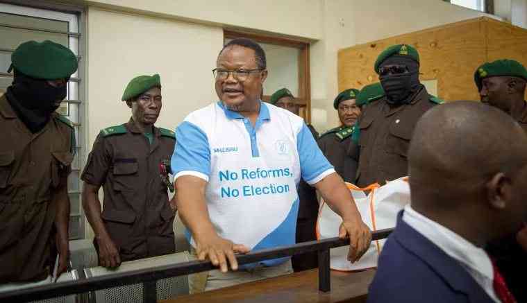 Detained Tanzania opposition figure says state delaying trial ahead of polls