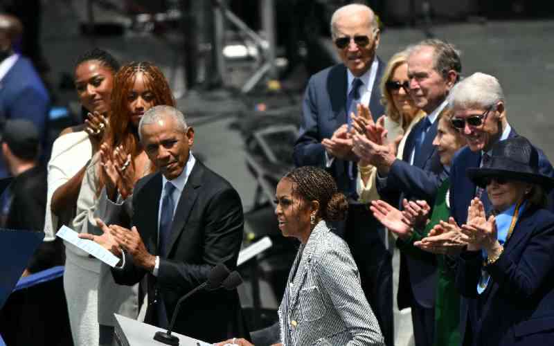 Ex-presidents, stars, but no Trump, turn out for Obama Center