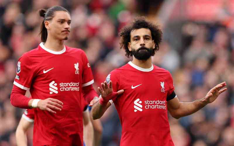 Salah scores twice as Liverpool beats 10-man Everton in Merseyside derby