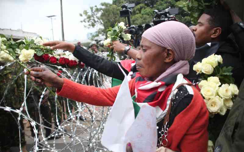 Wreaths, barriers mark protest anniversary