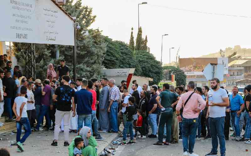 Lebanese take refuge in shelters after long trips fleeing Israeli bombing