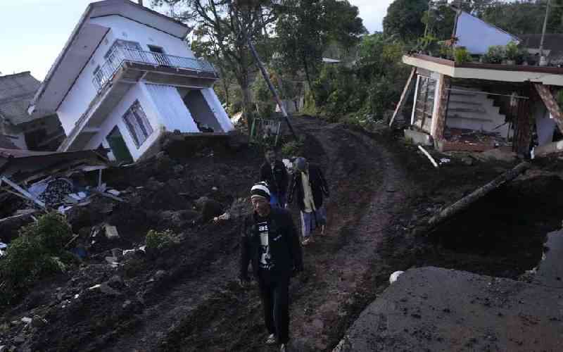 Indonesian rescuers focus on landslide as quake toll rises