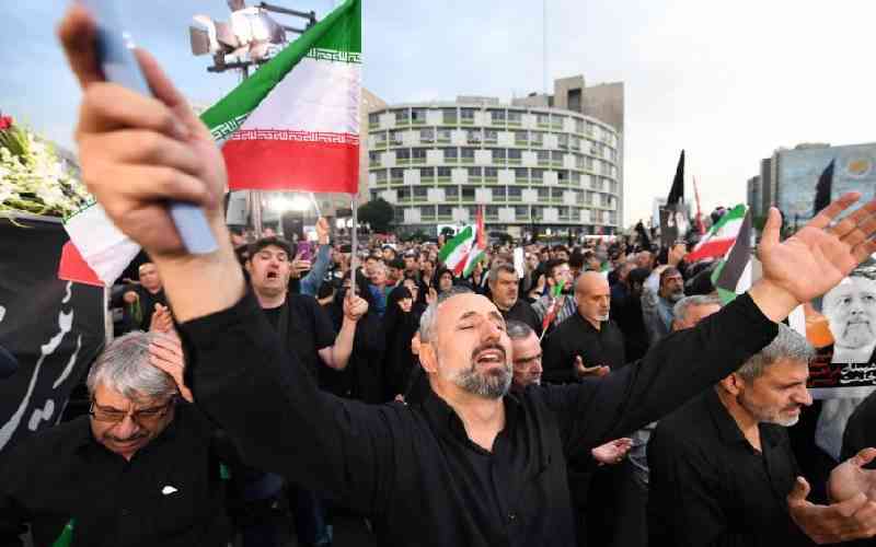 People in Iran's capital bid farewell to late president