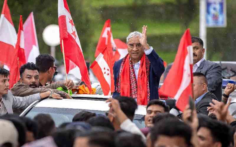 Former Nepal premier Deuba returns home, faces graft probe