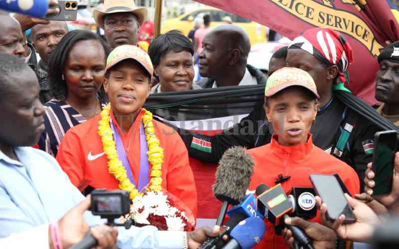 Pomp and colour as world champions jet back from Tokyo