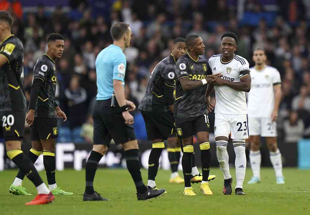 10-man Leeds grabs point against Villa in EPL