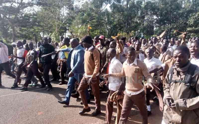 Students strike after police vehicle knocks down three students, killing one