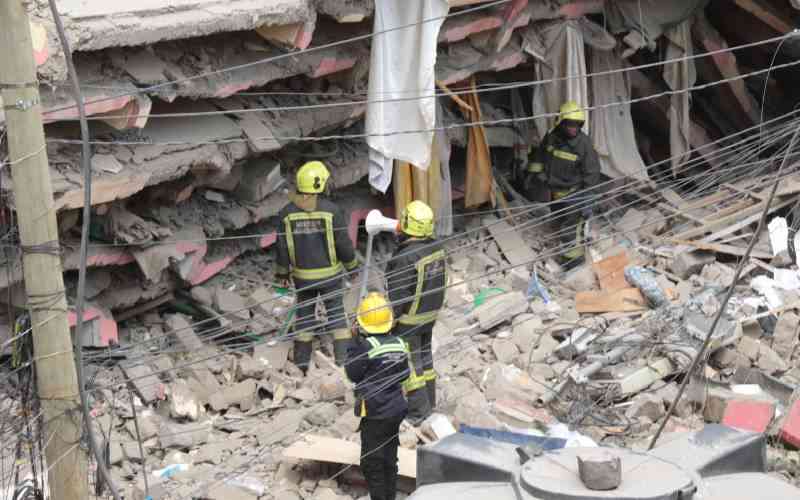 Highrise building collapses in city search on for mother, child