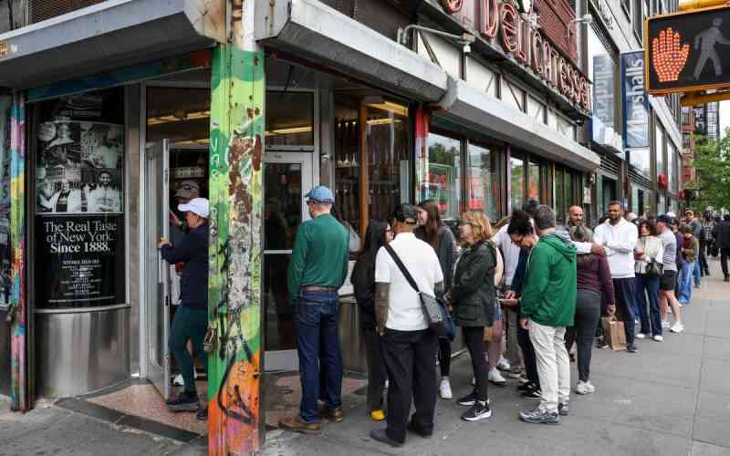 In New York, waiting in line becomes a social scene