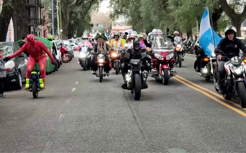 Superheroes on wheels bring toys, smiles to children in Buenos Aires
