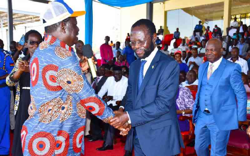 Raila Odinga attends Nyong'o's swearing-in, asks supporters to be calm