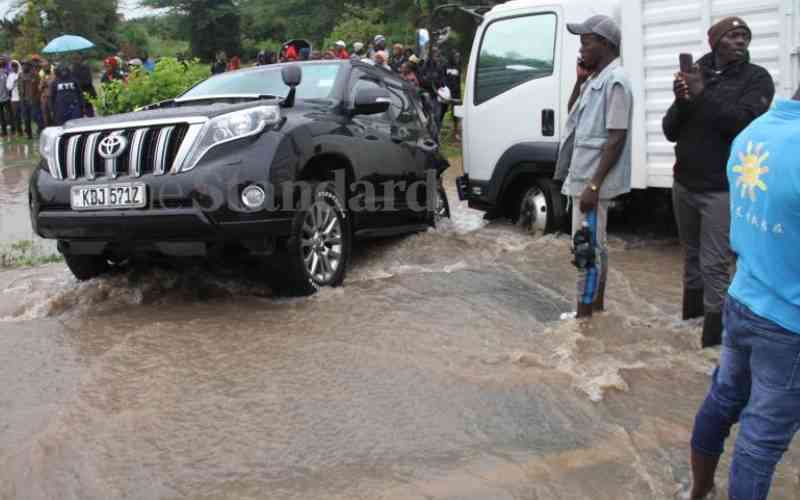 Families marooned by floods as motorists spend hours on roads