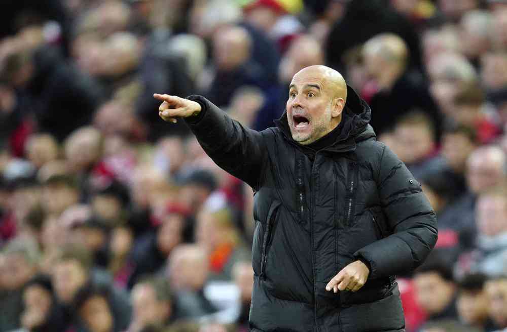 Guardiola says Liverpool fans threw coins at him