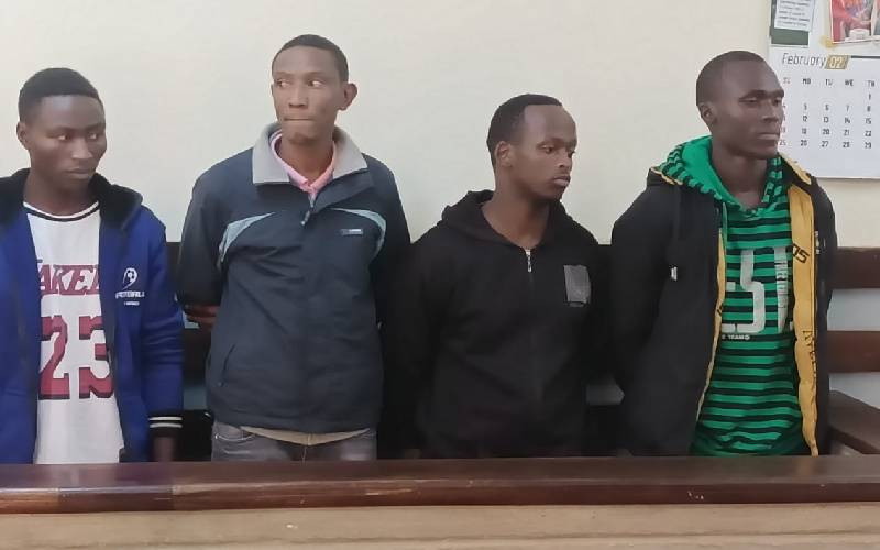 Three police officers, civilian charged with gun theft
