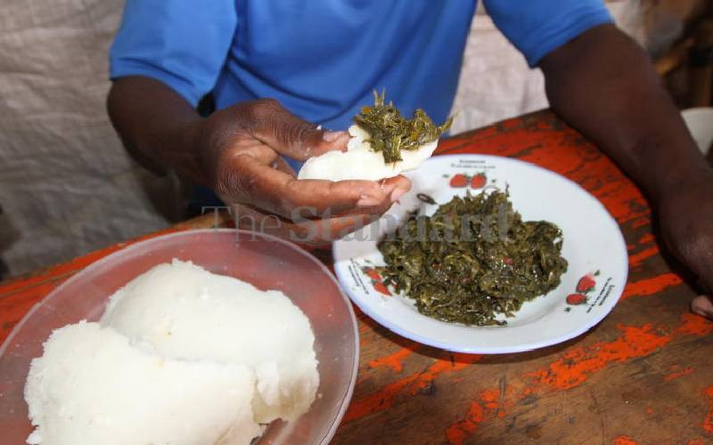 Kenyans eating food contaminat...