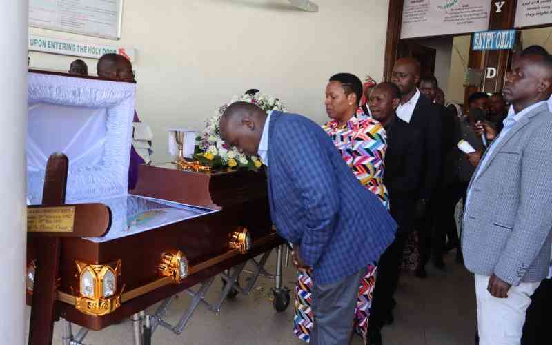 Slain Catholic priest laid to ...