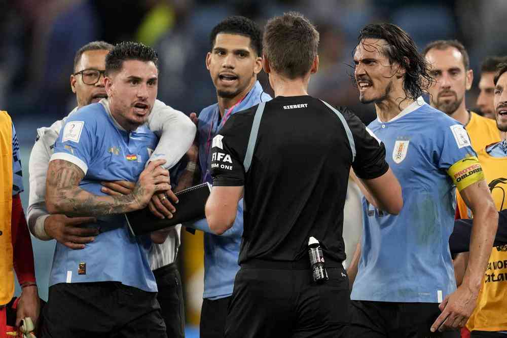 Uruguay players charged for confronting World Cup referee