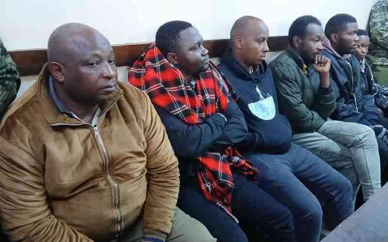 Ojwang's kin watch in silence as suspects deny murdering him