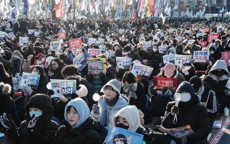 Thousands of South Koreans protest as president digs heels in