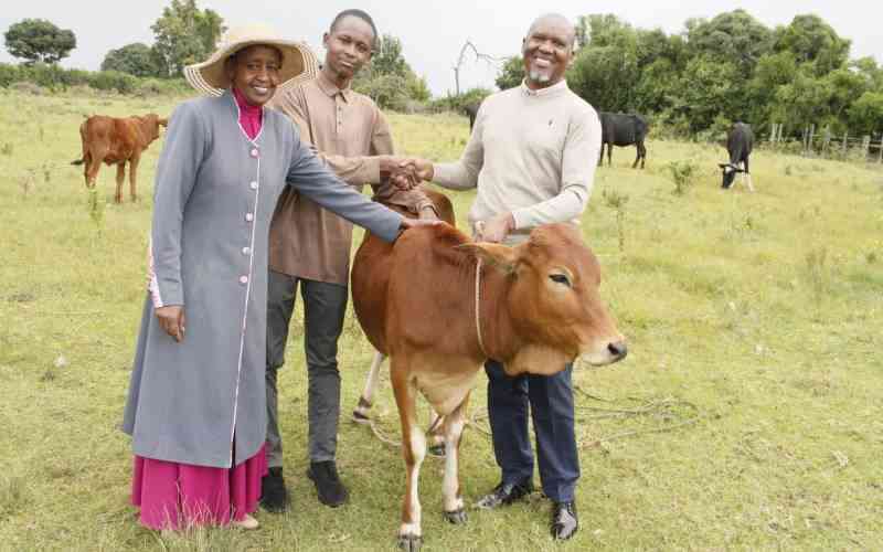 Proud father gifts son cow for scoring A in KCSE