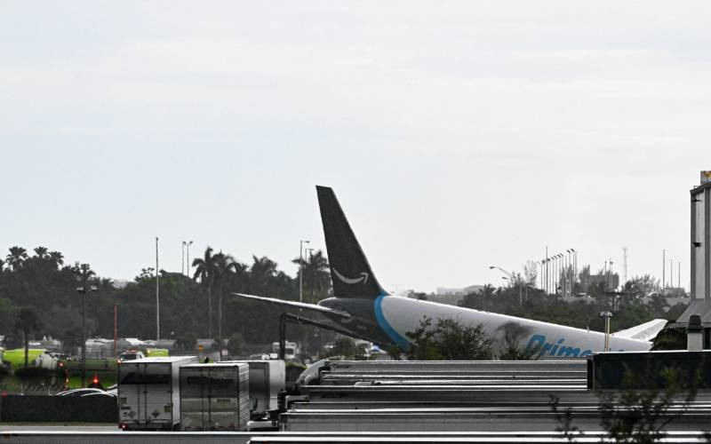 Amazon cargo plane overshoots Miami runway, hits vehicles, catches fire
