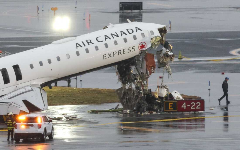 PHOTOS: Two pilots killed after Air Canada jet crashes into fire engine in New York