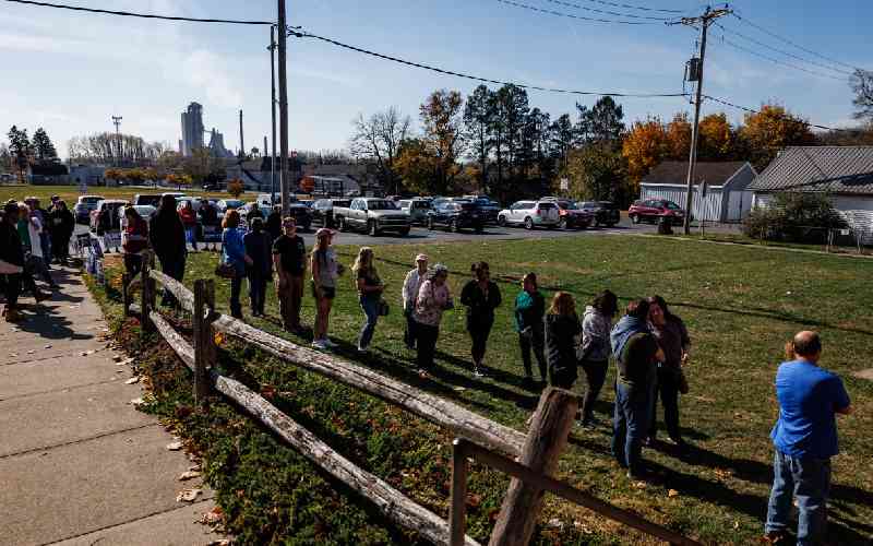 Harris or Trump? Long lines of...