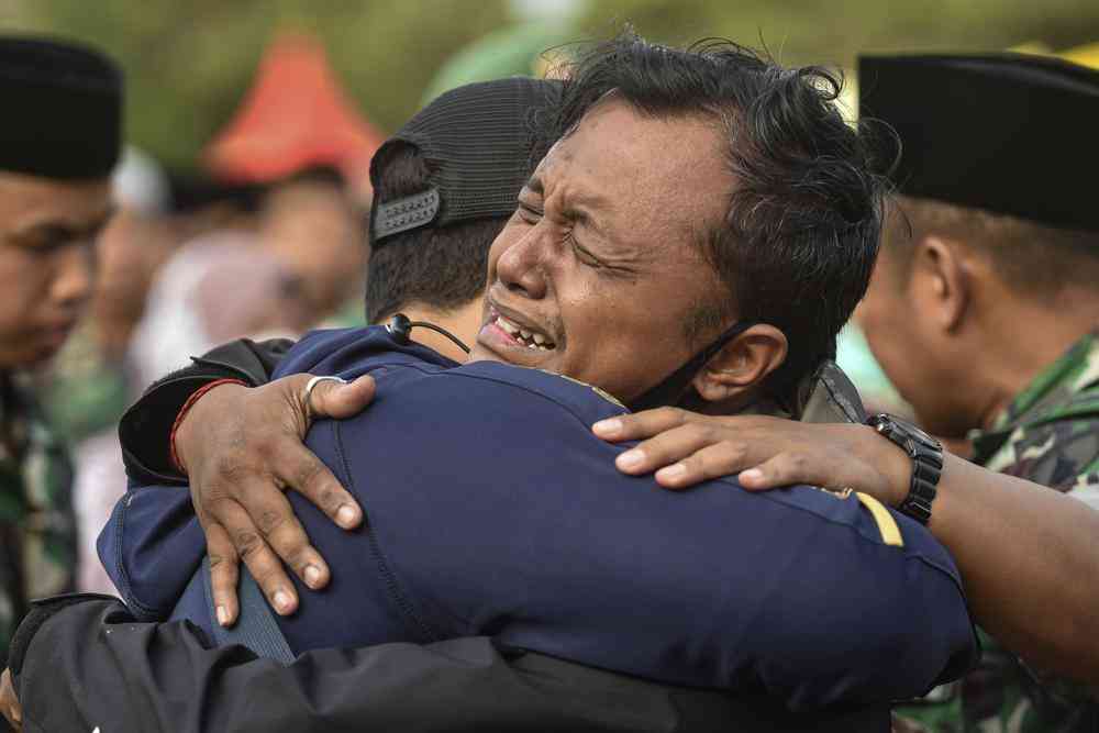 Indonesian leader says locked gates contributed to deaths