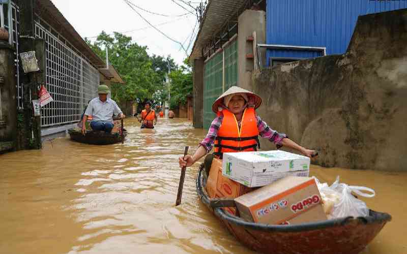 'Scared': desperate Vietnamese flee flood-hit homes