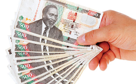 Shilling weakens as firms buy dollars before Budget