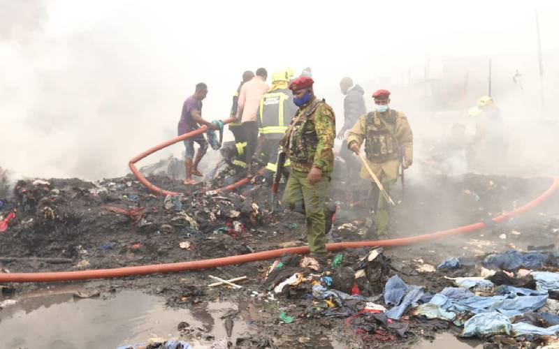 Security officers comb through razed section