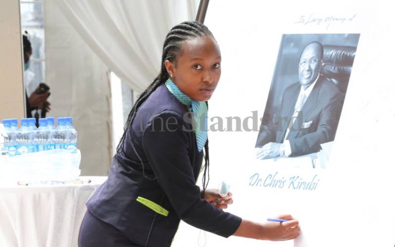 Florence Wambui signs Chris Kirubi's portrait 