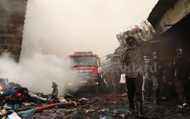 A trader salvaging his wares at Gikomba