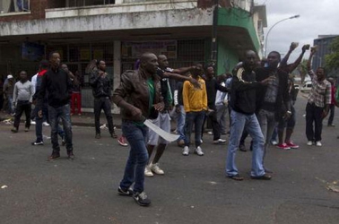 South African police disperse immigrant vigilante group