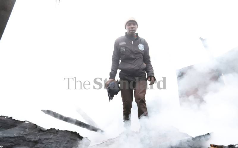 Resident walking through rubble