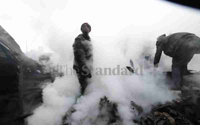 turning and poking charred remains for easy...