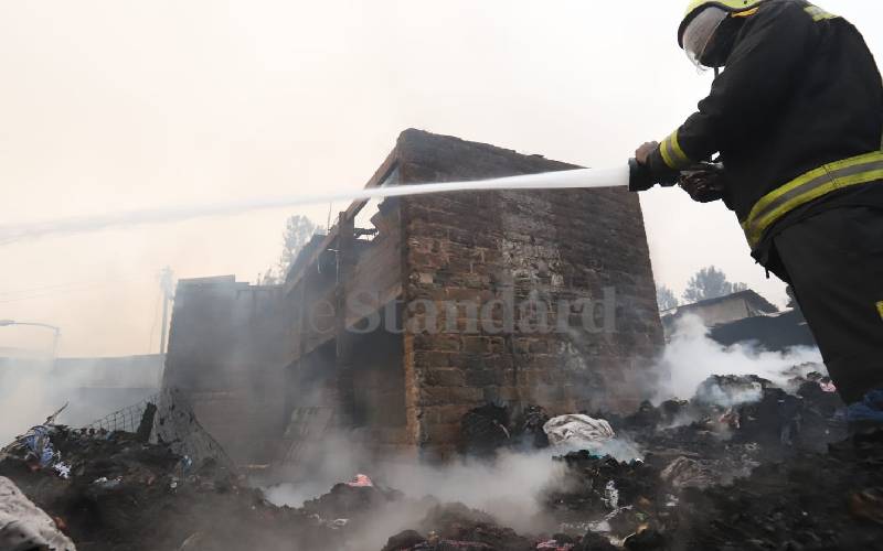 A firefighter spraying water