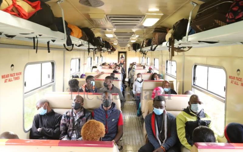 Passengers inside the first locomotive.