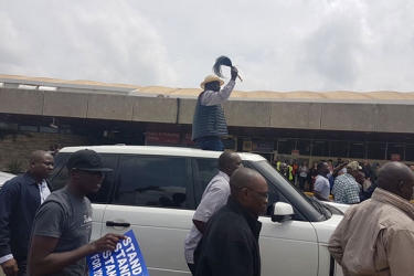 Raila Odinga lands at JKIA as police battle supporters