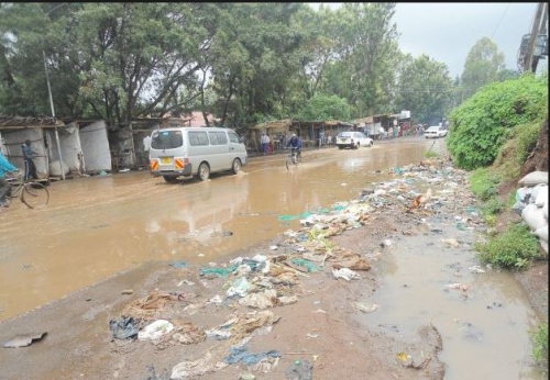 Lang'ata constituency – wading through flooded road following a sewer that burst during the heavy rains. 