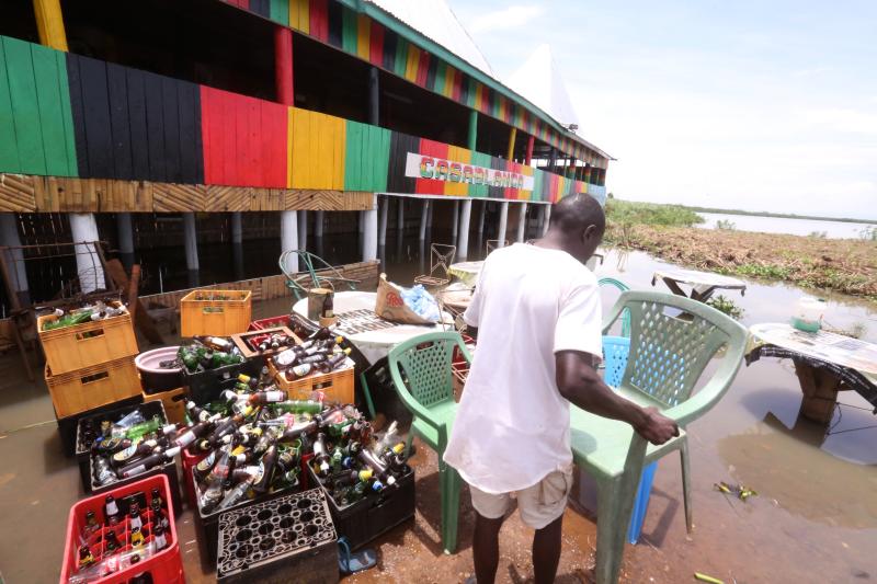 Traders count losses as lake floods businesses