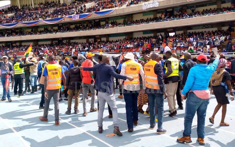 Security controlling the crowd at Kasarani. 