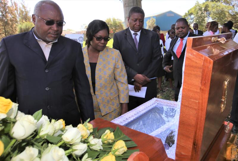 Justice Anthony Ombwayo, Olga Sewe, Chief Magistrate Charles Obulutsa and his counterpart Harrison Baraza (right) view the body of the clerk David Ouma during a memorial service at the Law Court on Friday.