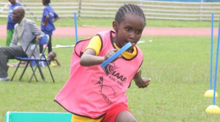 Focused on better tomorrow:  Children parade for the IAAF Kids Athletics event