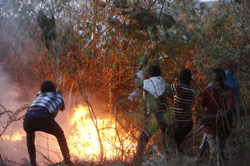 Boys try to put out fire at Menengai Forest