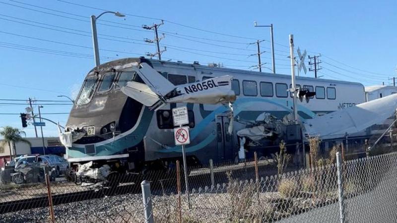 Plane hit by train after crashing on tracks in California
