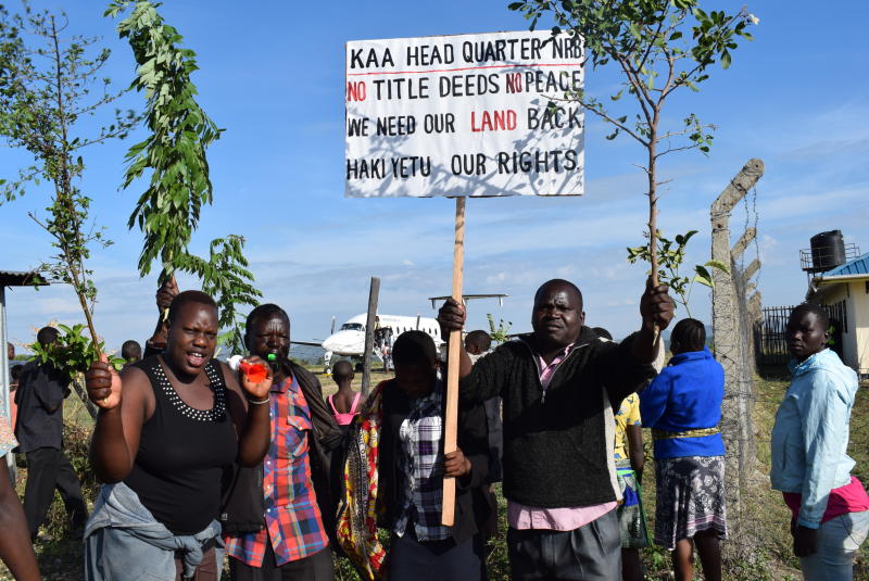 Residents demonstrate at Kabunde Airstrip in Homa Bay County to demand compensation for their land. The demonstration caused tension which paralysed services at the airstrip. [James Omoro, Standard]  